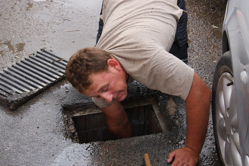 Agustí­n clearing storm drain