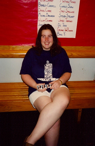 Arica holds photo booth photos of her and Roger