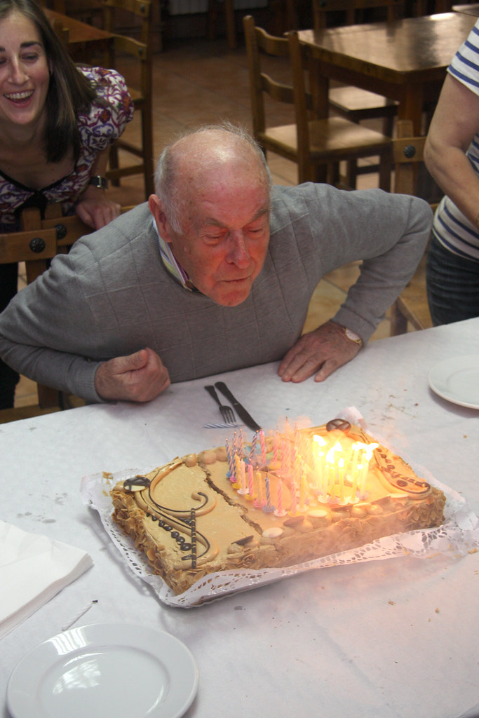 Abuelo extinguishes candles