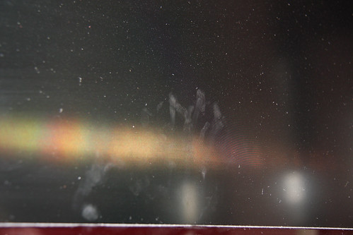 Fingerprints on dusty television screen