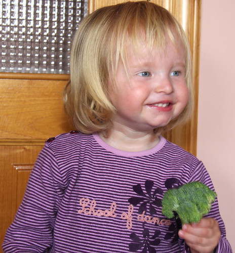 Nora eating broccoli